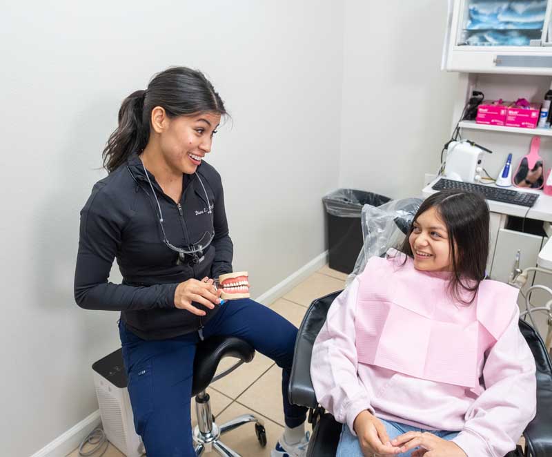 discussing Invisalign options at Mothers' Choice Dental