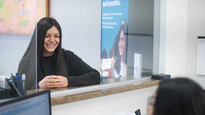 patient smiling during her visit to Mothers' Choice Dental